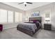 Serene bedroom with plush carpeting, modern shutters, and a contemporary color palette at 29344 N 132Nd Ln, Peoria, AZ 85383