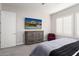 Relaxing main bedroom with soft carpeting, plantation shutters, dresser and a calming atmosphere at 29344 N 132Nd Ln, Peoria, AZ 85383