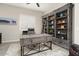 Well-appointed office highlights stylish desk and custom shelving, creating an organized workspace at 29344 N 132Nd Ln, Peoria, AZ 85383