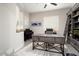 Sophisticated office space boasts custom shelving and a large desk, blending functionality with style at 29344 N 132Nd Ln, Peoria, AZ 85383