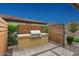 Built-in outdoor grill area with ample counter space, perfect for outdoor cooking and entertaining in the backyard at 29344 N 132Nd Ln, Peoria, AZ 85383