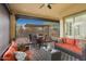 Comfortable outdoor living space with cozy seating, a dining table, and a covered patio for relaxing or entertaining at 29344 N 132Nd Ln, Peoria, AZ 85383