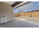 Inviting back patio with sleek pergola cover, offering an ideal space for outdoor relaxation and entertainment at 2962 E Birdsong Ave, San Tan Valley, AZ 85143