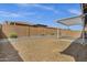 Landscaped backyard featuring a gravel ground cover, raised planter beds, and a covered patio area at 2962 E Birdsong Ave, San Tan Valley, AZ 85143