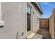 Backyard door showing access to patio, and showing exterior facade of home at 2962 E Birdsong Ave, San Tan Valley, AZ 85143