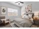 Serene bedroom featuring a ceiling fan, comfortable seating, and calming decor at 2962 E Birdsong Ave, San Tan Valley, AZ 85143