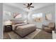 Cozy bedroom featuring a ceiling fan, natural light, and neutral decor at 2962 E Birdsong Ave, San Tan Valley, AZ 85143