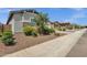 Street view of a home with a well-manicured front yard and a stone facade at 2962 E Birdsong Ave, San Tan Valley, AZ 85143