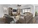 Bright living room featuring modern furnishings, a ceiling fan, and sliding glass doors to the patio at 2962 E Birdsong Ave, San Tan Valley, AZ 85143