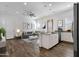 Open-concept living space with sleek island and bright natural light at 2962 E Birdsong Ave, San Tan Valley, AZ 85143