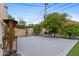 Serene backyard featuring a spacious deck and lush trees at 307 E Catalina Dr, Phoenix, AZ 85012