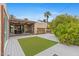 Inviting backyard featuring a spacious deck, covered patio, and well-manicured lawn at 307 E Catalina Dr, Phoenix, AZ 85012
