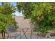 Inviting backyard space with seating area, trees and gravel at 307 E Catalina Dr, Phoenix, AZ 85012