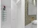 Modern bathroom featuring a large shower, unique tilework, and a floating sink at 307 E Catalina Dr, Phoenix, AZ 85012