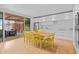 Bright dining room featuring a modern kitchen, hardwood floors and yellow chairs at 307 E Catalina Dr, Phoenix, AZ 85012