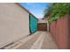 Long driveway leading to a detached garage, providing ample parking space and privacy at 307 E Catalina Dr, Phoenix, AZ 85012