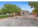 Inviting home exterior featuring a well-manicured yard, stucco walls, and a tile roof at 307 E Catalina Dr, Phoenix, AZ 85012