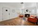 Bright living room featuring a cozy fireplace, hardwood floors, and stylish decor at 307 E Catalina Dr, Phoenix, AZ 85012