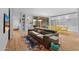 Open-concept living room with shelving, modern furniture, and bright lighting at 307 E Catalina Dr, Phoenix, AZ 85012