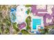 Aerial view of community amenities with waterpark, lap pool, and recreation center surrounded by lush greenery at 3613 W Plymouth Dr, Anthem, AZ 85086