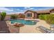 Sparkling pool with rock accents, deck chairs, and privacy landscaping in this backyard oasis at 3613 W Plymouth Dr, Anthem, AZ 85086
