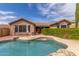 Backyard view featuring a refreshing pool, privacy landscaping, and lounging area at 3613 W Plymouth Dr, Anthem, AZ 85086