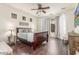Bright bedroom with wood floors, ceiling fan, many windows, and neutral-colored walls at 3613 W Plymouth Dr, Anthem, AZ 85086