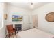 Bedroom featuring wood floors, a TV, and a large window with blinds at 3613 W Plymouth Dr, Anthem, AZ 85086
