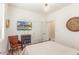Bedroom with a full window, vintage chair, and a console with a TV displaying a pool at 3613 W Plymouth Dr, Anthem, AZ 85086