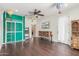 Spacious bonus room featuring hardwood floors, high ceilings, and bright teal cabinets at 3613 W Plymouth Dr, Anthem, AZ 85086