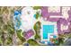 Aerial view of the community pool area, featuring a splash pad, water slide, and lap pool at 3613 W Plymouth Dr, Anthem, AZ 85086