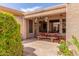 Inviting covered patio with brick flooring and a wooden picnic table perfect for outdoor dining at 3613 W Plymouth Dr, Anthem, AZ 85086