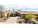 Charming single-story home with a tile roof, well-manicured landscaping, and a spacious driveway at 3613 W Plymouth Dr, Anthem, AZ 85086
