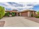 Well-maintained one-story home featuring an attached garage and desert-friendly landscaping at 3613 W Plymouth Dr, Anthem, AZ 85086