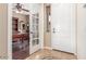 Welcoming foyer with tiled flooring and clear views into a study area through French doors at 3613 W Plymouth Dr, Anthem, AZ 85086