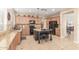 Open kitchen design features granite counters, dark appliances, seating at the island, and plenty of cabinet space at 3613 W Plymouth Dr, Anthem, AZ 85086