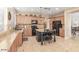 Light, bright kitchen featuring granite countertops, dark appliances and a large center island at 3613 W Plymouth Dr, Anthem, AZ 85086
