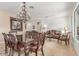 Spacious living and dining room area with a chandelier and tiled floors at 3613 W Plymouth Dr, Anthem, AZ 85086