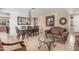 Inviting living room with elegant chandelier, decorative furniture, and warm, neutral tones throughout at 3613 W Plymouth Dr, Anthem, AZ 85086