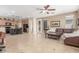 Open living area with island kitchen, black appliances, tile flooring, and comfortable seating at 3613 W Plymouth Dr, Anthem, AZ 85086