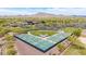 Aerial view showcases pickleball courts with mountain backdrops, perfect for sports enthusiasts at 3613 W Plymouth Dr, Anthem, AZ 85086