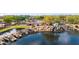 Scenic community pond featuring rock waterfalls, lush landscaping, and a playground in background at 3613 W Plymouth Dr, Anthem, AZ 85086