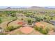 Aerial view showcasing the community baseball fields with scenic mountain views at 3613 W Plymouth Dr, Anthem, AZ 85086