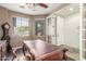 Home office featuring wooden floors, grand desk and a cozy atmosphere with natural light streaming through windows at 3613 W Plymouth Dr, Anthem, AZ 85086