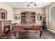 Traditional study with hardwood floors, custom built-ins, fireplace and antique desk at 3613 W Plymouth Dr, Anthem, AZ 85086