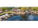 Scenic water feature with cascading waterfalls, a tranquil pond, lush greenery, and a nearby playground area at 3613 W Plymouth Dr, Anthem, AZ 85086