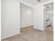 Hallway with tile floors leading to the kitchen at 39985 W Agave Rd, Maricopa, AZ 85138