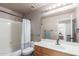 Bathroom with a tub, sink, and a large mirror at 4043 S Shady Ct, Gilbert, AZ 85297