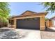 Single-Gathering home with a two-car garage, desert landscaping, and a well-maintained front yard at 4043 S Shady Ct, Gilbert, AZ 85297