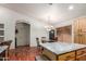 Bright kitchen features granite countertops, hardwood floors, and a chandelier over the dining table at 4043 S Shady Ct, Gilbert, AZ 85297